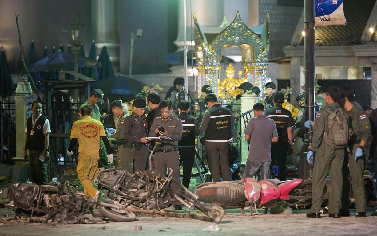 Police investigate the scene at the Erawan Shrine after an explosion in Bangkok, Thailand, on Monday.