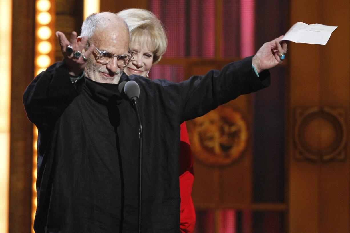 Associated Press files
Larry Kramer accepts the Tony Award for Best Revival of a Play for &quot;The Normal Heart&quot; on June 12, 2011, during the 65th annual Tony Awards in New York. Kramer, the playwright and AIDS activist turns 80 on Monday.