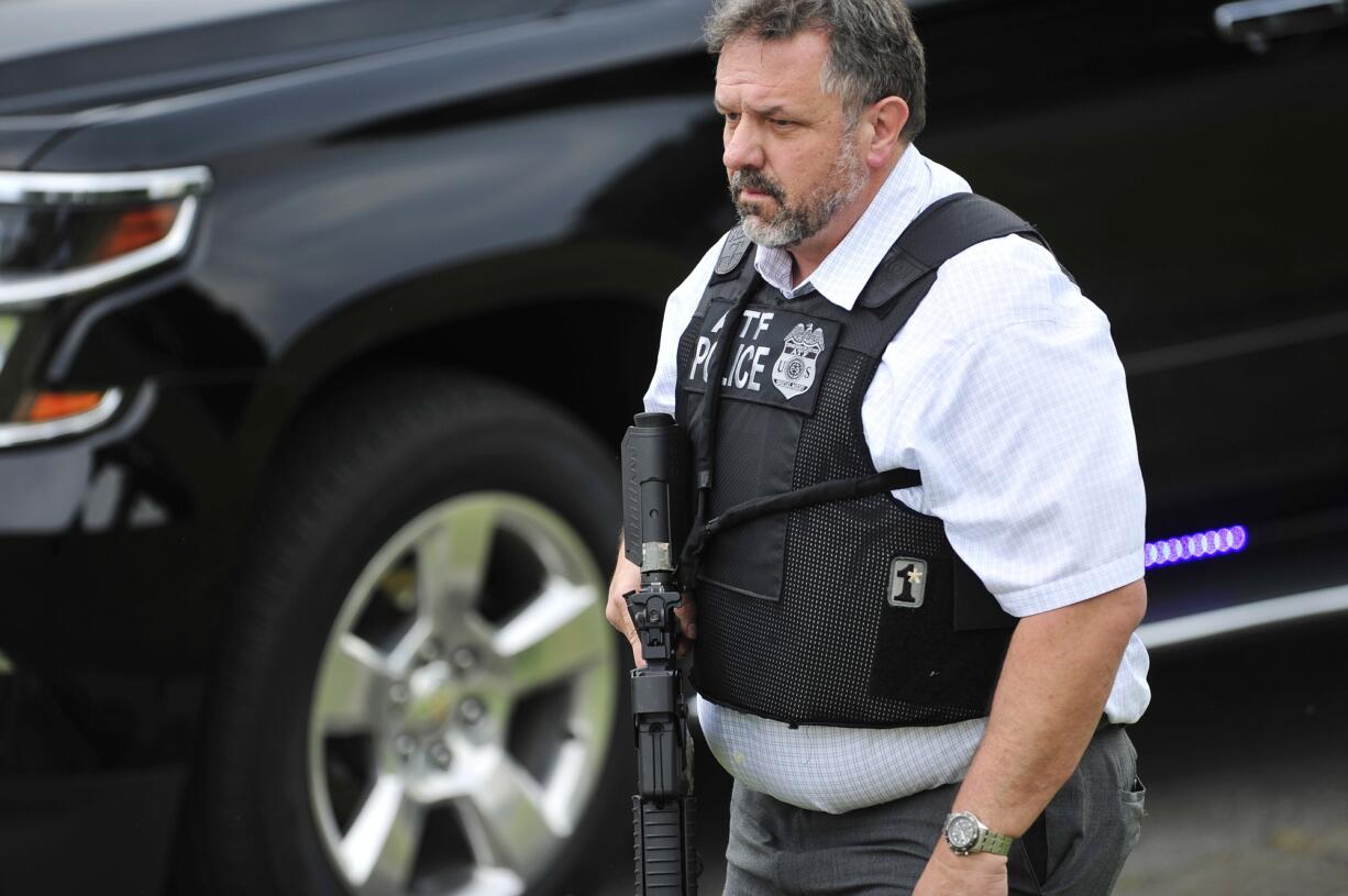 A police officer walks on the scene of a reported shooting Wednesday in Antioch, Tenn.