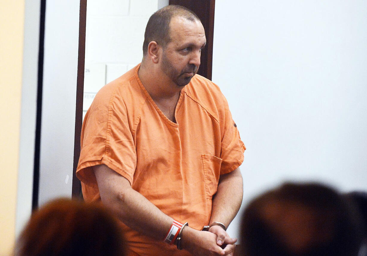 Craig Stephen Hicks, 46, enters the courtroom at the Durham County Detention Center for his first appearance on Wednesday.