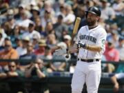 Seattle Mariners' Dustin Ackley tosses his bat after flying out in the seventh inning against the Detroit Tigers, Wednesday, July 8, 2015, in Seattle. The Tigers beat the Mariners 5-4. (AP Photo/Ted S.