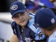 FILE - In this Oct. 20, 2013, file photo, Tennessee Titans quarterback Jake Locker talks on the sideline during the first quarter of an NFL football game against the San Francisco 49ers in Nashville, Tenn. Locker is retiring from football rather than hit free agency after four NFL seasons with the e Titans. He says in a statement Tuesday, March 10, 2015, that he no longer has the &quot;burning desire&quot; needed to keep playing the game for a living.