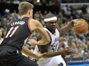 Memphis Grizzlies forward Zach Randolph (50) drives around Portland Trail Blazers center Meyers Leonard (11) during the second half Saturday, Jan. 17, 2015, in Memphis, Tenn. The Grizzlies won 102-98.