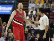 Chris Kaman, left, questions official Zach Zarba, after he was called for a defensive 3-second violation Friday.