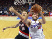 Portland Trail Blazers center Joel Freeland, left, has improved his defense and field goal percentage this season.