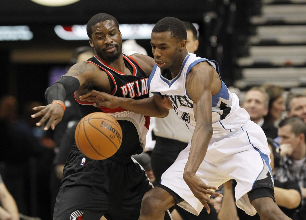 Portland Trail Blazers guard Wesley Matthews, left, strips the ball from Minnesota Timberwolves forward Andrew Wiggins during the first quarter Wednesday in Minneapolis.