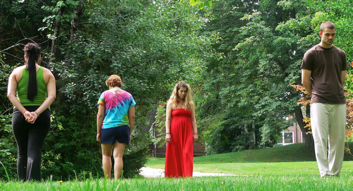 Individuals participate in a walking meditation on the grounds of the Insight Meditation Society (IMS) Retreat Center in Barre, Mass. The Buddhist-influenced center offers silent retreats that allow individuals to take a break from the stresses and demands of daily modern life.