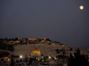 Associated Press files
The roof restaurant of the Notre Dame hotel straddles the invisible line between east and west Jerusalem and offers an elevated view of the adjacent holy sites.