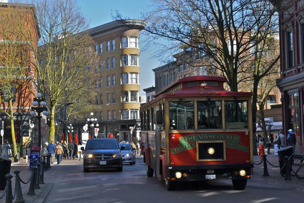 Gastown, a neighborhood in Vancouver, B.C., is the heart of old Vancouver with tree-lined, cobbled sidewalks and historic buildings.