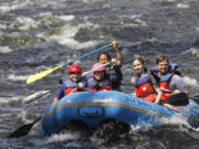 Whitewater rafters going down the Sacandaga River in Lake Luzerne, N.Y.