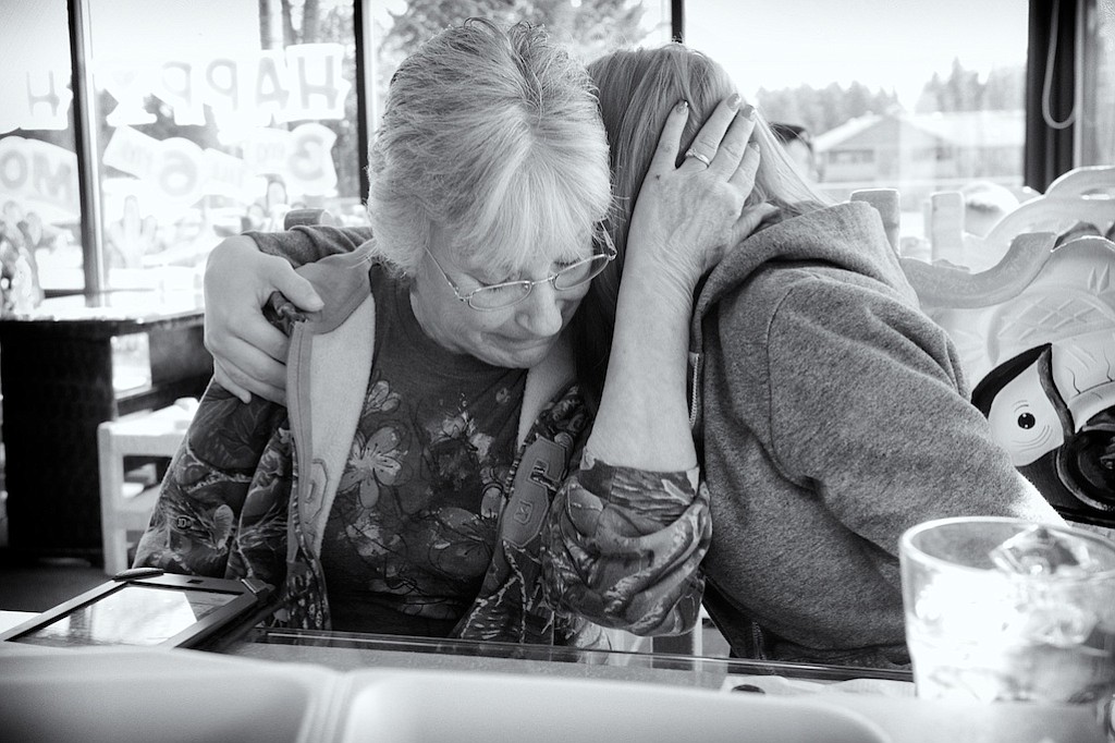 Mandy Cooper, right, hugs her cousin Norma Adams as Norma breaks down knowing the hardships Mandy is going through with drug abuse.