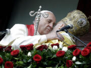 Pope Francis, left, hugs Ecumenical Patriarch Bartholomew I after a holy liturgy Sunday at the Patriarchal Church of St. George in Istanbul.