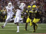 Washington State wide receiver Rickey Galvin (5) catches a Connor Halliday pass for a touchdown while guarded by Oregon safety Tyree Robinson (2) and safety Erick Dargan (4) as wide receiver River Cracraft (21) watches during the second quarter Saturday, Sept. 20, 2014, at Martin Stadium in Pullman, Wash.