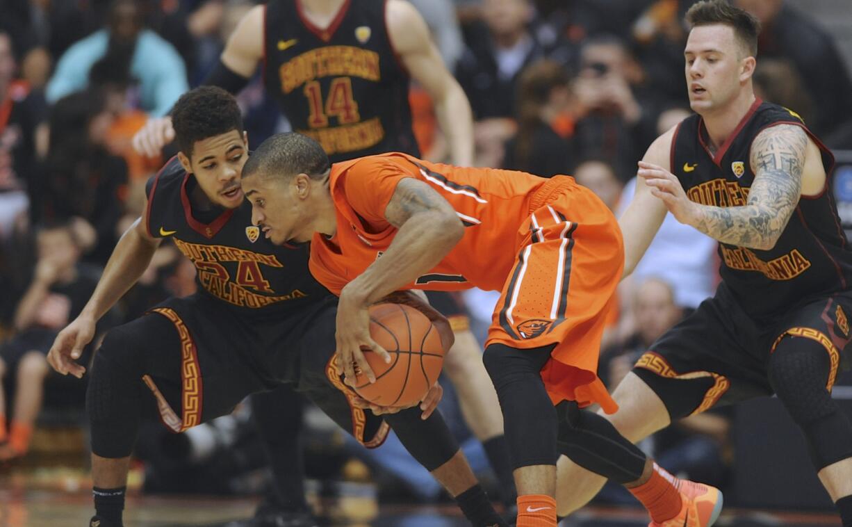 USC's Malik Marquetti (24) defends against Oregon State's Gary Payton II during the first half Saturday, Jan. 24, 2015 at Corvallis, Ore. Payton scored 21 points and had 10 rebounds in OSU's 59-55 win.