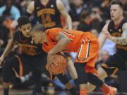 USC's Malik Marquetti (24) defends against Oregon State's Gary Payton II during the first half Saturday, Jan. 24, 2015 at Corvallis, Ore. Payton scored 21 points and had 10 rebounds in OSU's 59-55 win.