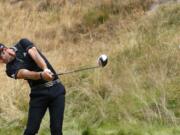 Dustin Johnson hits his tee shot on the eighth hole during the first round of the U.S.