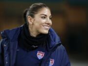 U.S. goalkeeper Hope Solo was reinstated by U.S. Soccer after a 30-day suspension and is on the travel roster for next month's Algarve Cup in Portugal.