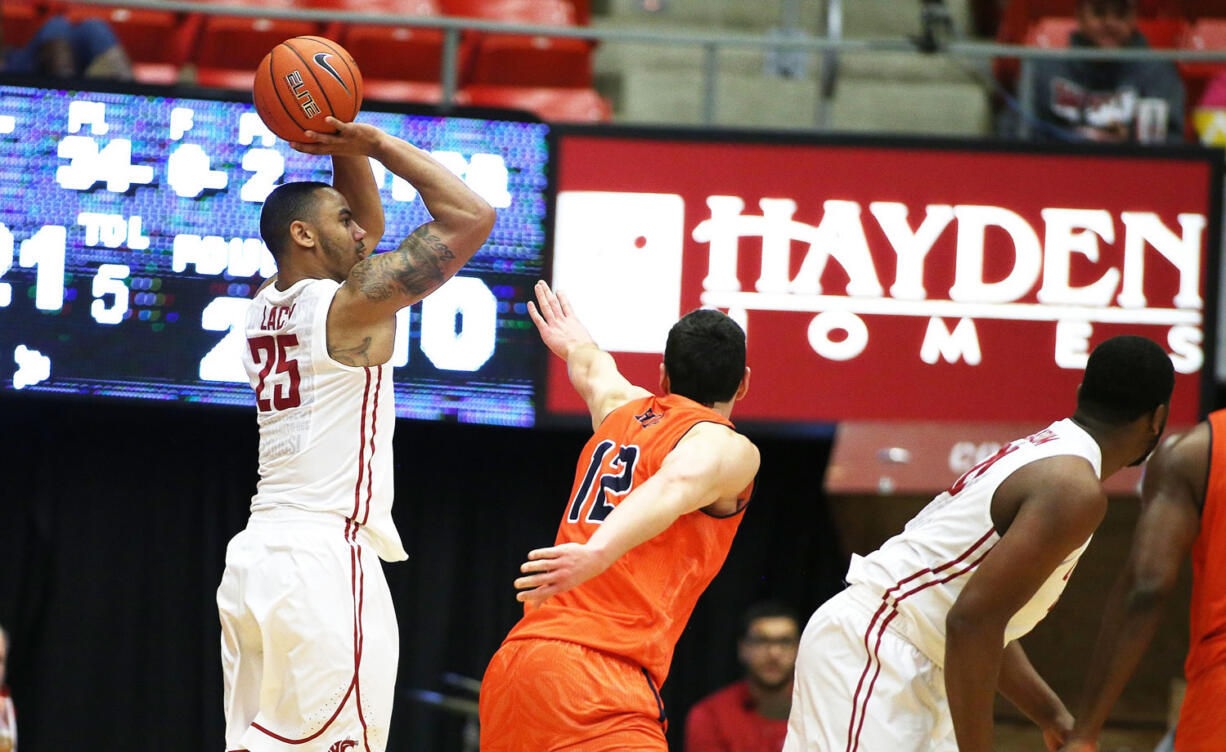 Washington State's DaVonte Lacy (25) takes a jump shot against UTSA's Jeromie Hill (12) during the first half in Pullman on Saturday, Dec. 6, 2014.