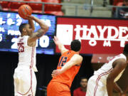 Washington State's DaVonte Lacy (25) takes a jump shot against UTSA's Jeromie Hill (12) during the first half in Pullman on Saturday, Dec. 6, 2014.