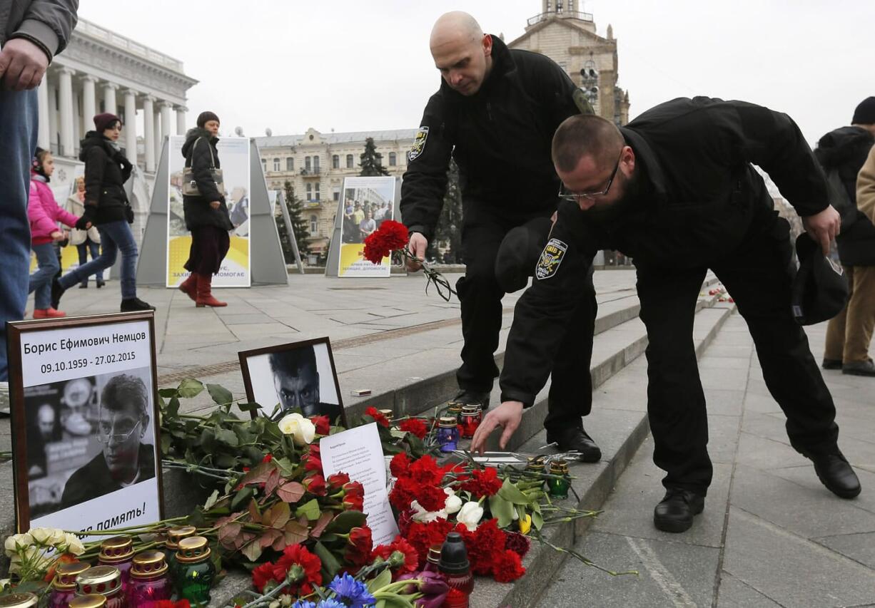 People lay flowers Saturday to pay their respect to Boris Nemtsov, a charismatic Russian opposition leader and sharp critic of President Vladimir Putin, in Independence Square in Kiev, Ukraine.