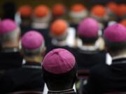 Bishops and Cardinals attend a Monday morning session of a two-week synod on family issues at the Vatican. Catholic bishops scrapped their landmark welcome to gays Saturday, showing deep divisions at the end of a two-week meeting sought by Pope Francis to chart a more merciful approach to ministering to Catholic families.