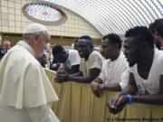 Pope Francis salutes migrants from Nigeria during his weekly general audience he held in the Pope Paul VI hall, at the Vatican on Wednesday.