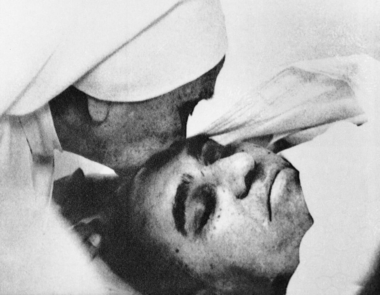 Associated Press files
A nun plants a kiss on the forehead of Archbishop Oscar Arnulfo Romero of El Salvador on March 23, 1980, at the Hospital of Divine Providence. Pope Francis decreed Tuesday that the slain Salvadoran archbishop was killed in 1980 out of hatred for his Catholic faith, approving a martyrdom declaration that sets the stage for his beatification.