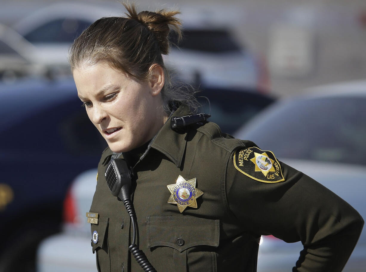 Las Vegas police officer Nicole Hemsey wears a body camera, seen on her shoulder,on Nov. 12 in Las Vegas.