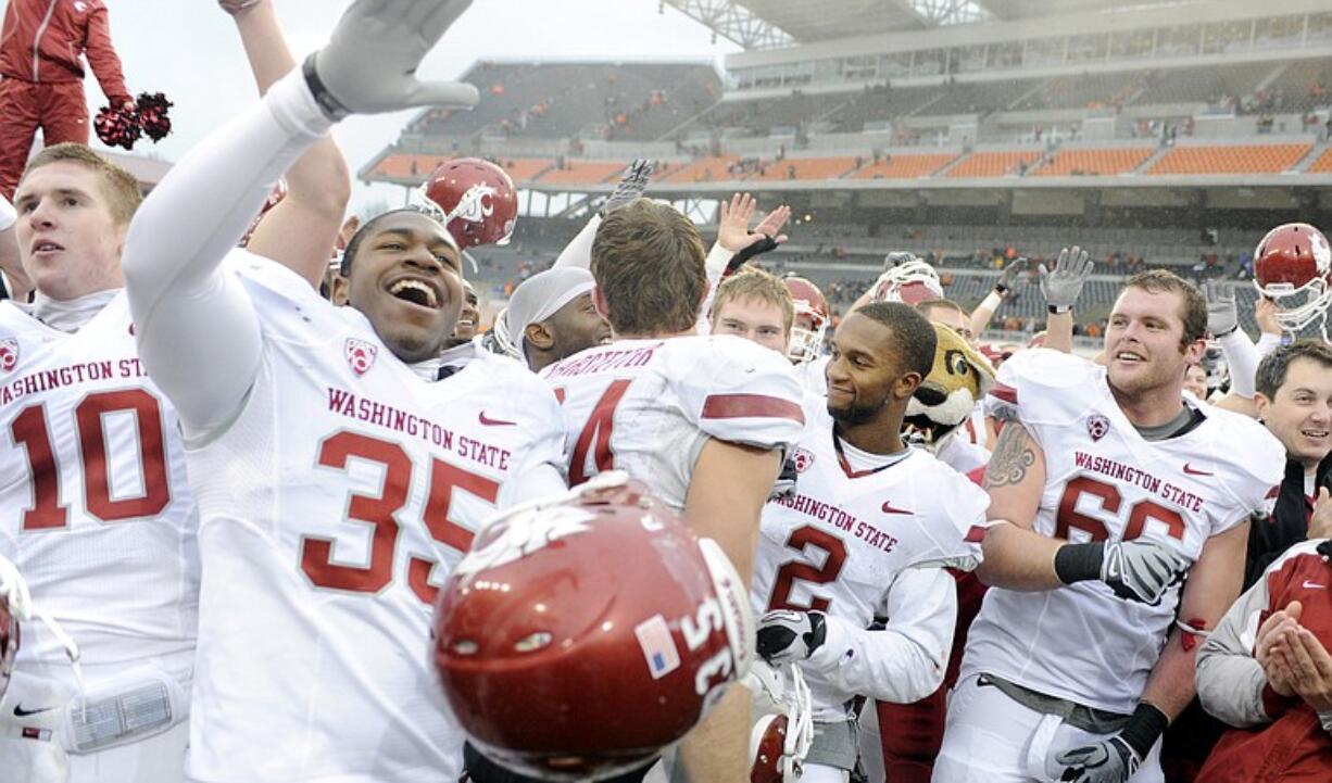 Washington State players celebrate their 31-14 victory against Oregon State on Saturday in Corvallis.