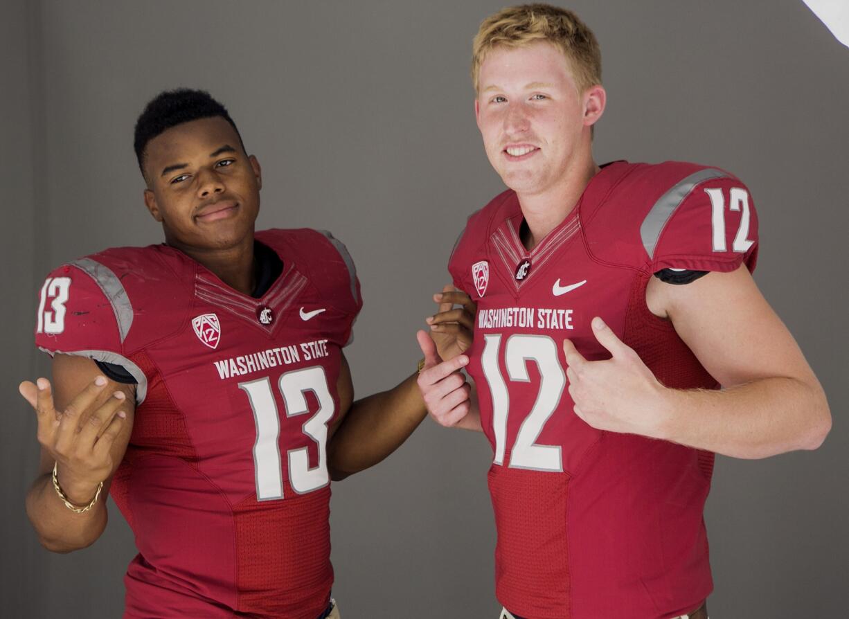 Washington State linebacker Darryl Monroe, left, and quarterback Connor Halliday pose for photos at the 2014 Pac-12 NCAA college football media days at Paramount Studios in Los Angeles Wednesday, July 23, 2014.