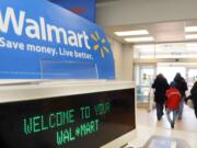 Shoppers leave a Wal-Mart in Danvers, Mass.