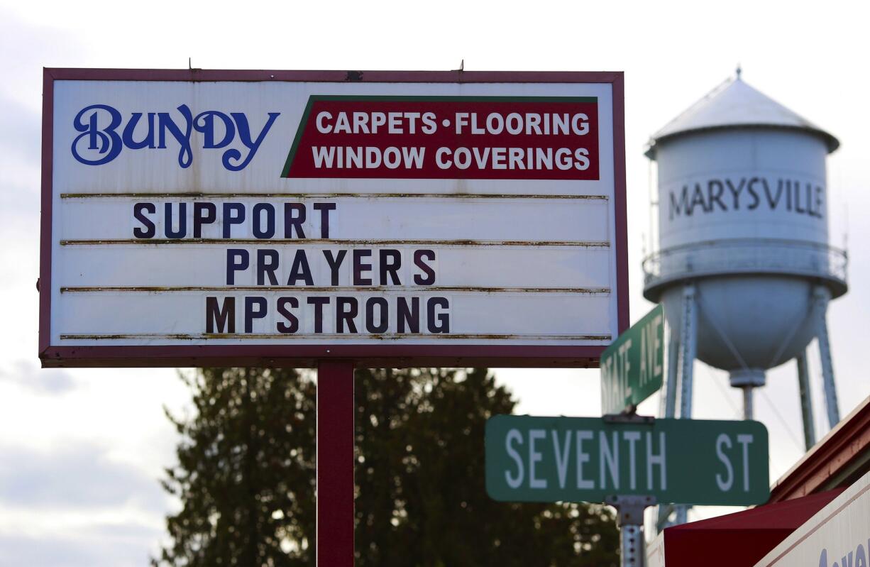 A variety of supportive signs have appeared on businesses along State Street in Marysville after a deadly shooting Friday at Marysville-Pilchuck High School.