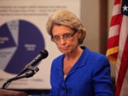 Gov. Chris Gregoire listens to a reporter's question after giving her presentation Thursday in Olympia.