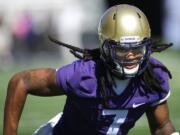 Washington linebacker Shaq Thompson runs through a drill during the first session of NCAA college football practice before the upcoming fall season, Monday, Aug. 4, 2014, in Seattle. (AP Photo/Ted S.