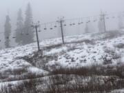 Snow is patchy Feb. 5 beneath Reggie's Chair at the Summit at Snoqualmie, which has operated only about 40 days this season. A mild winter is wreaking havoc with the mountain snowpack that is supposed to provide water during dry summer months.