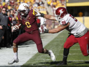 Washington State's Xavier Cooper (96) shoves Arizona State's D.J. Foster (8) out of bounds during the second half  Saturday, Nov. 22, 2014, in Tempe, Ariz. Arizona State defeated Washington State 52-31. (AP Photo/Ross D.