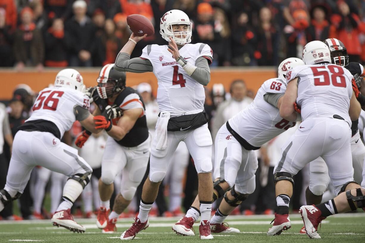 Washington State quarterback Luke Falk (4) passes against Oregon State in Corvallis, Ore., Saturday, Nov. 8, 2014.