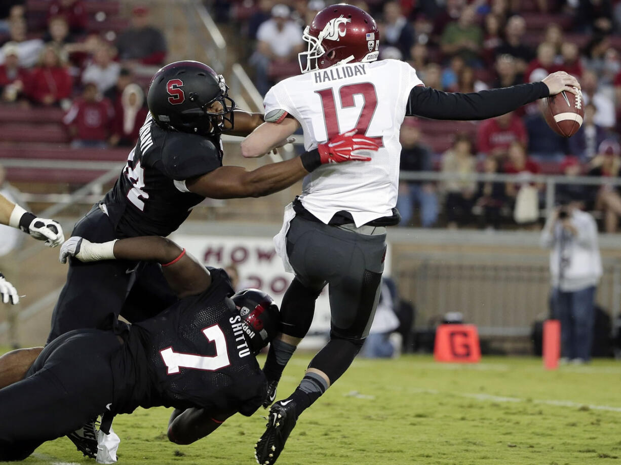 Stanford linebacker Peter Kalambayi, left, sacks Washington State quarterback Connor Halliday (12) during the Cardinal's win Friday over the Cougars.