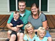 Jake Hanes, with his wife, Melanie Hanes, and their three children, had parts of both of his legs amputated after an accident while chopping down a tree on May 1.