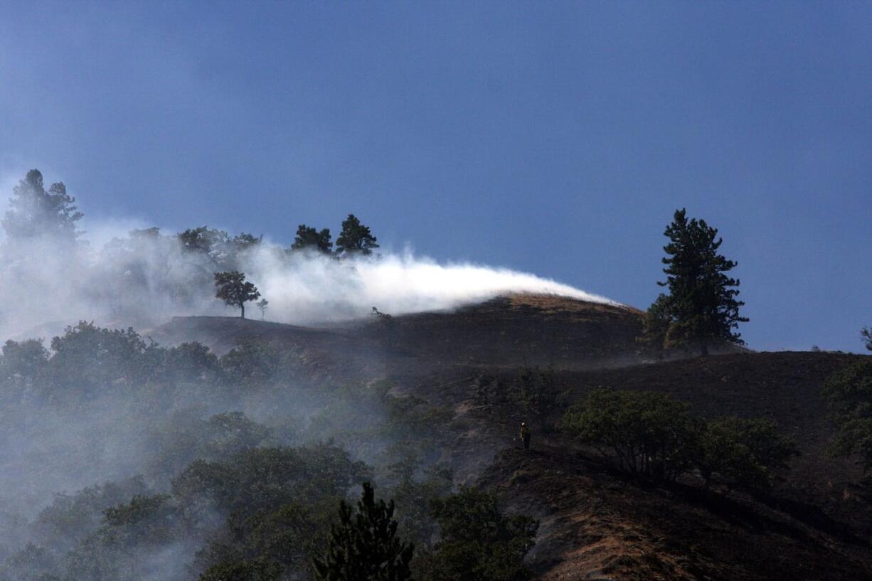 Smoke rises from the Rowena fire in Oregon amid high winds and dry conditions on Wednesday.