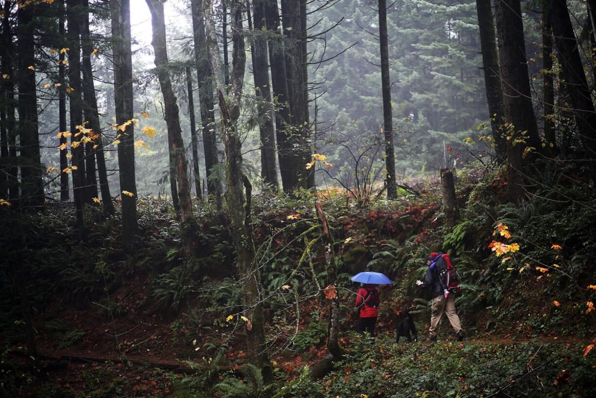 A couple walks the Bridge of the Gods Trailhead on the Pacific Crest Trail in Cascade Locks, Ore., in November 2013.