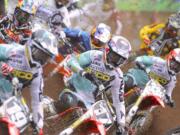 Eli Tomac (17) center, races in the 250 class at the 2013 Lucas Oil Pro Motocross Championships in Washougal He will be competing in the 450 class on Saturday in his return to Washougal.