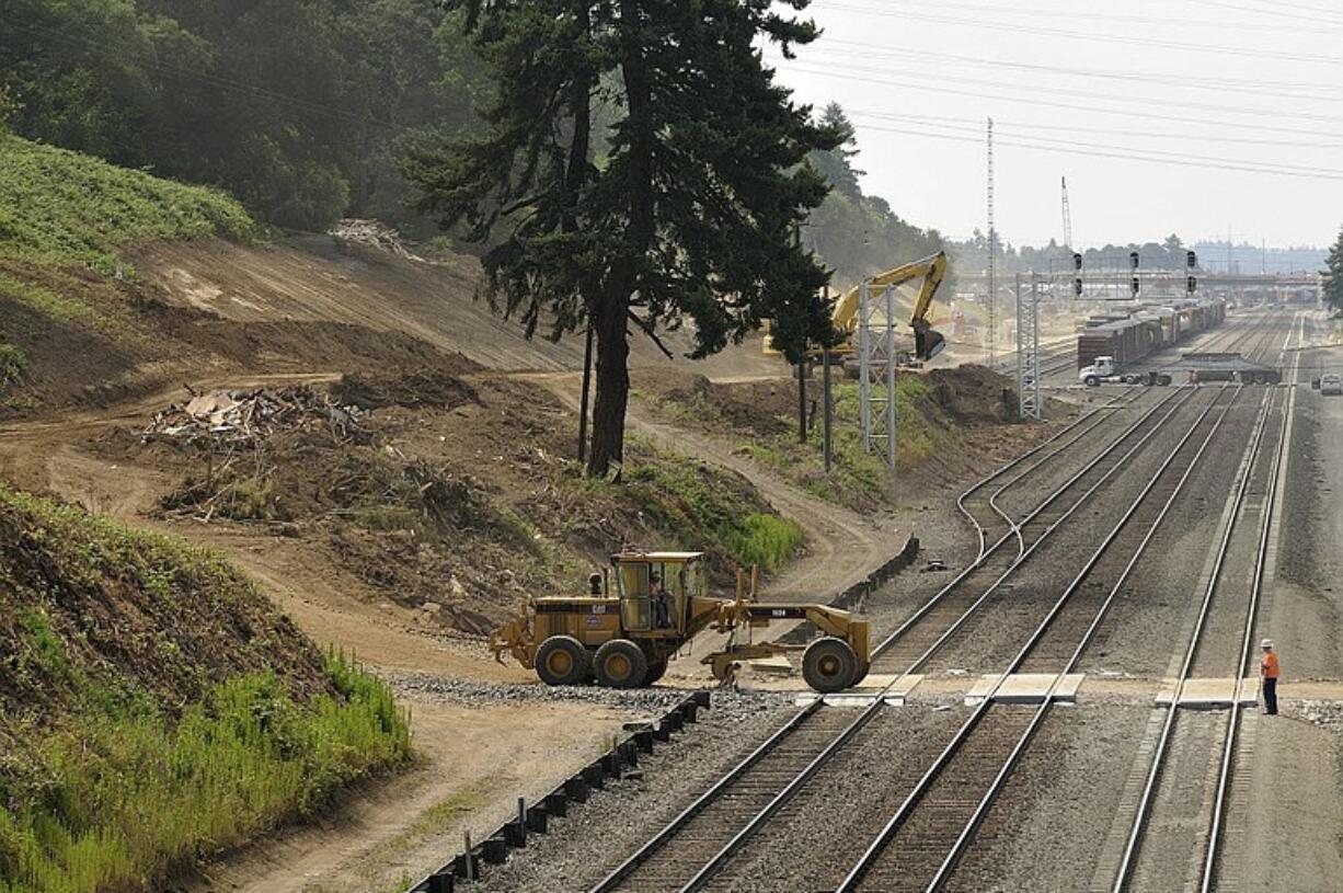 The completion of cleanup efforts at the site of a former scrap metal yard in west Vancouver clears the way for a broader $150 million rail improvement project, part of a state-directed effort to improve freight and passenger mobility.