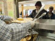 Lunch is served to the homeless at Share house in Vancouver on April 23.