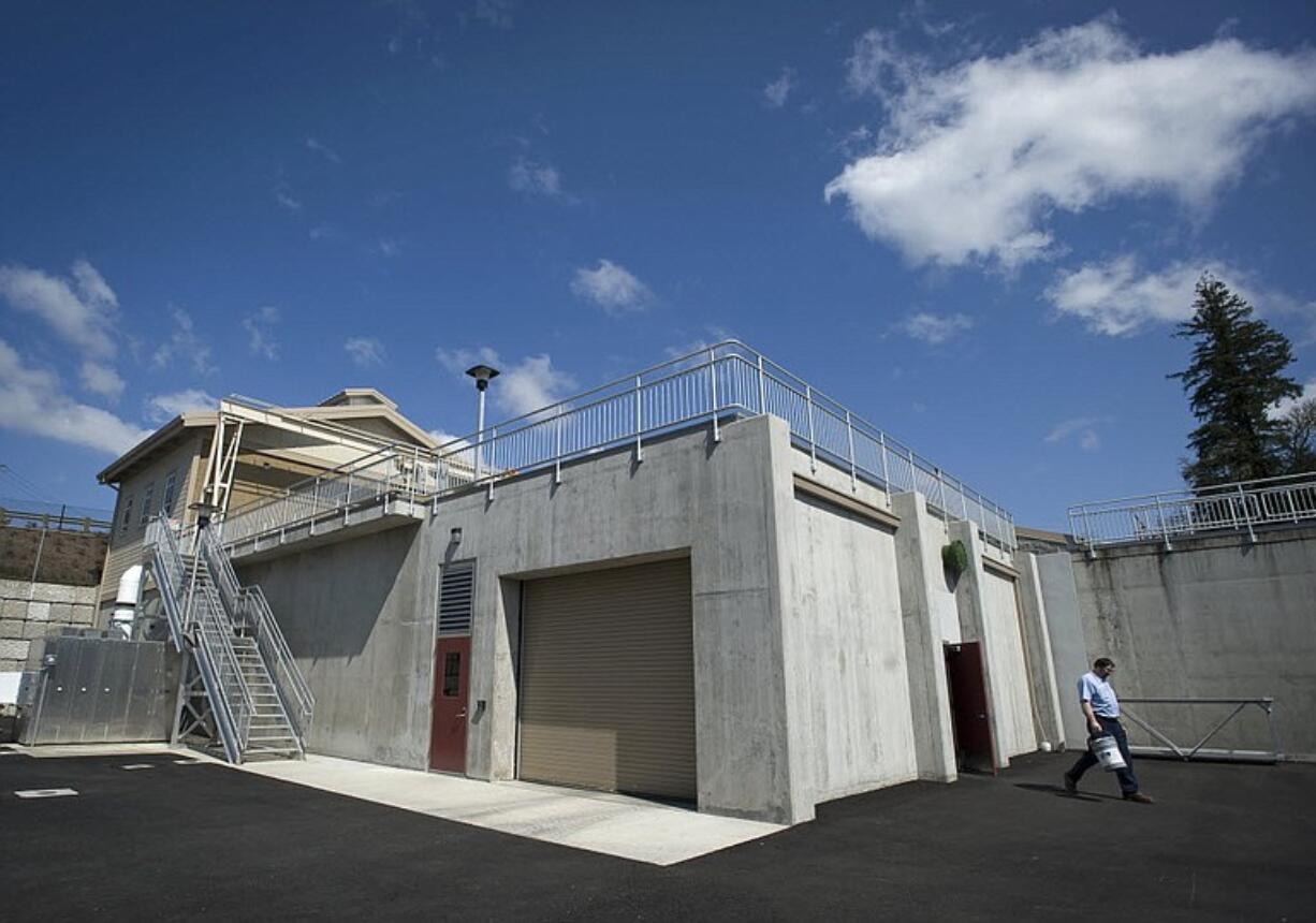 Bill Birdwell, waste water operator in training, walks across the facility in La Center on Friday.