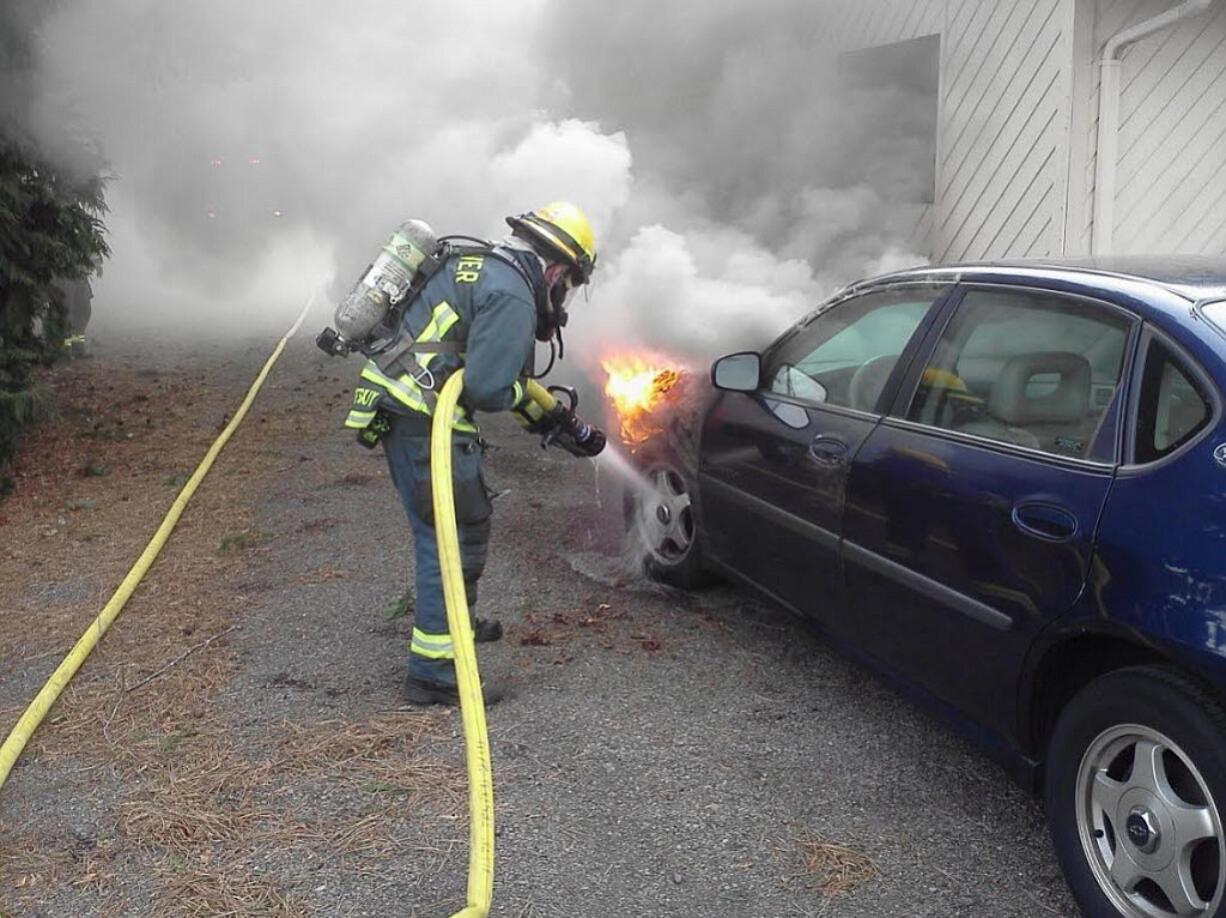 Firefighters quickly extinguished a vehicle fire this afternoon before it spread to a nearby residence in Brush Prairie