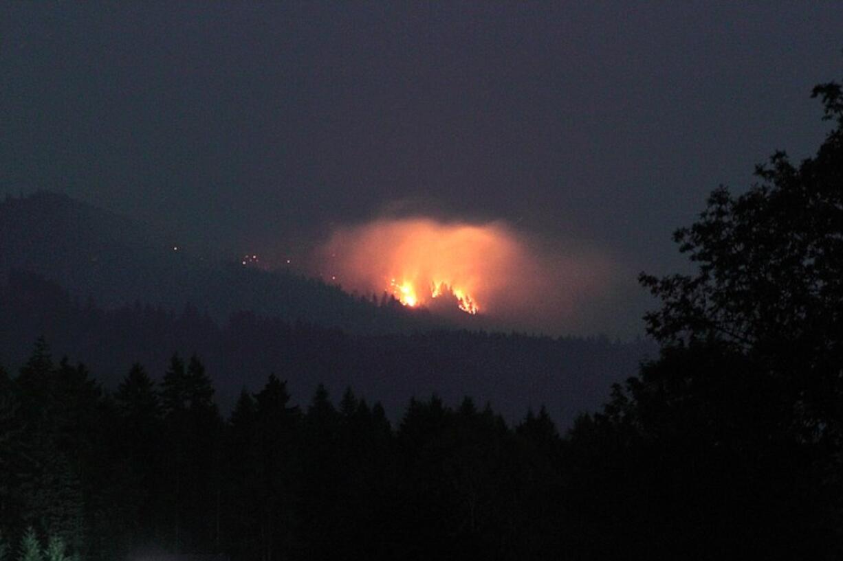 A fire, seen here from entrance of the Hockinson Meadows Park on Saturday night, is burning in the Yacolt Burn State Forest.