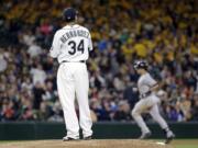 Felix Hernandez (34) watches as New York's Mark Teixeira rounds the bases on a grand slam in the fifth inning.