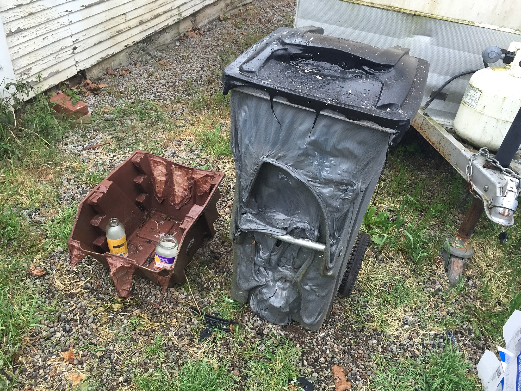 Garbage and recycle receptacles were melted by a late night fire that destroyed a detached garage in west Vancouver.