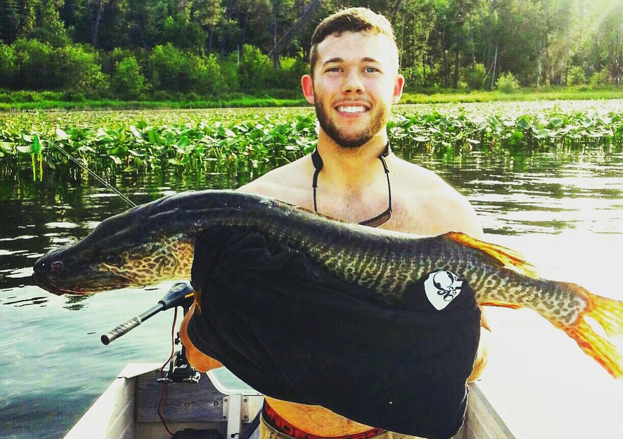 Levi Anderson holds his lunker tiger musky from Newman Lake.